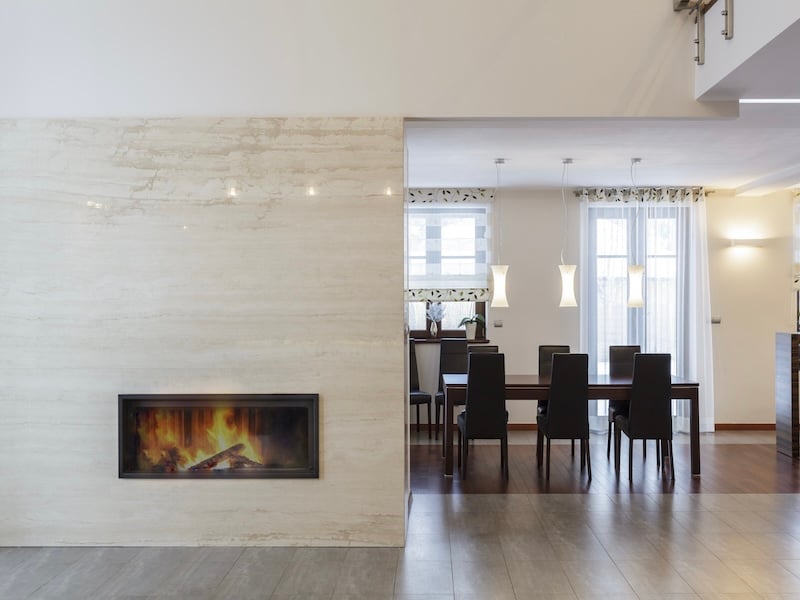 Fireplace Design Ideas For Custom Homes and Major Remodels - Recessed Linear Fireplace In A Natural Stone Surround