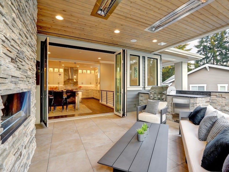 How To Design The Perfect Outdoor Living Space - Folding or Retractable Glass Doors